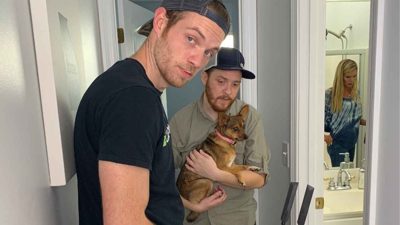 James with a dog on a film set