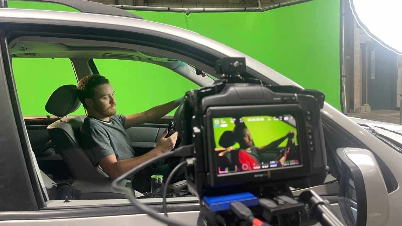 James lighting a car on the green screen stage